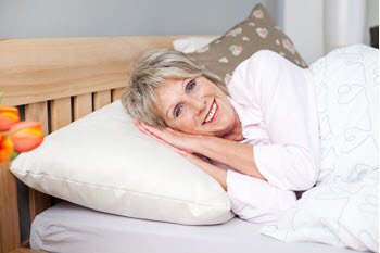 Older women laying down to goto bed