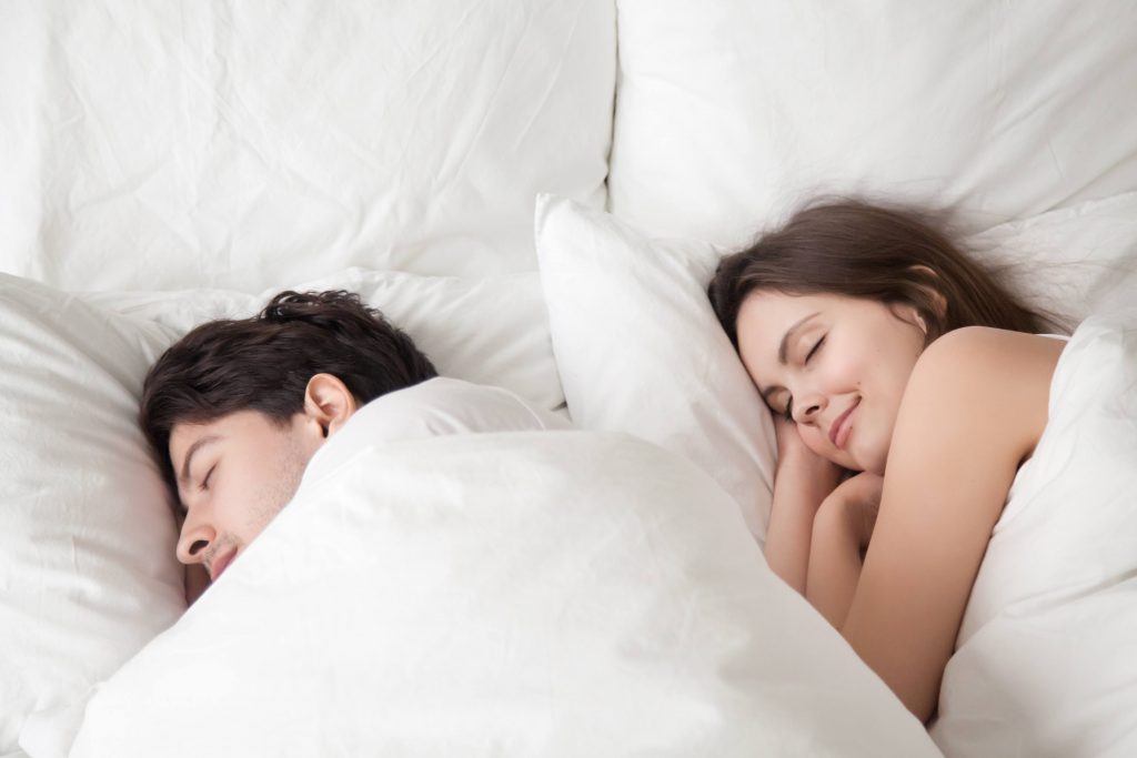 Couple sleeping soundly because of CPAP machine