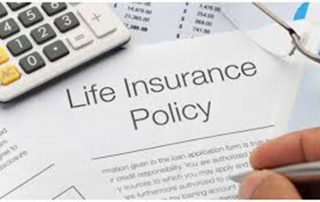 person signing a life insurance policy